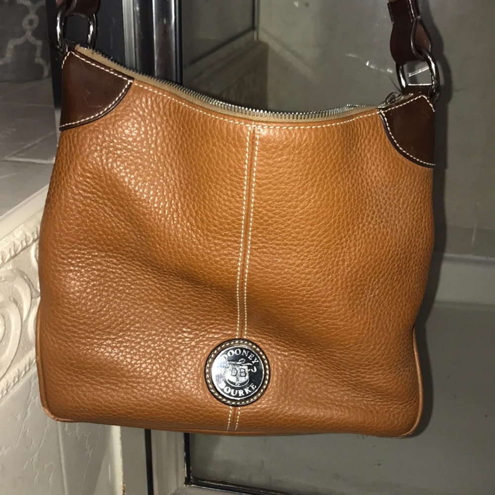 GENTLY USED DOONEY & BURKE CROSS OVER